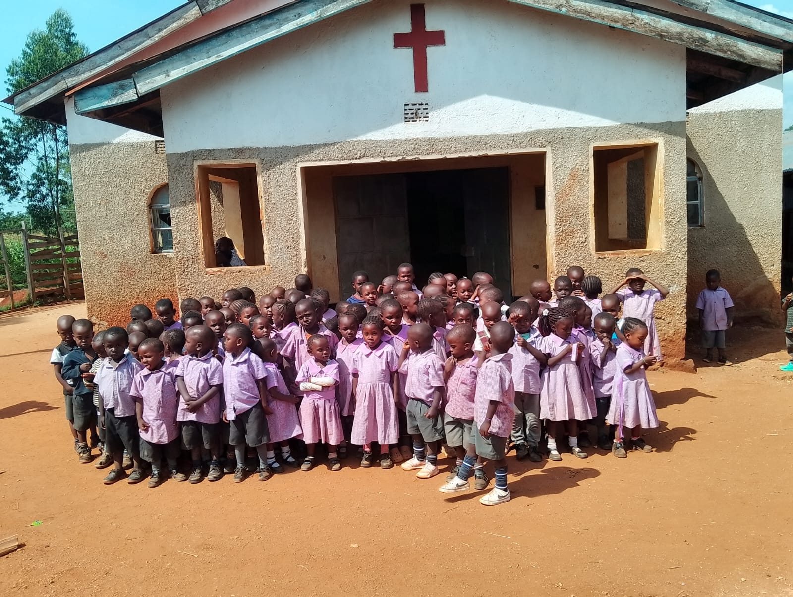 Placeholder photo: pupils in school uniform seated together for a group photo