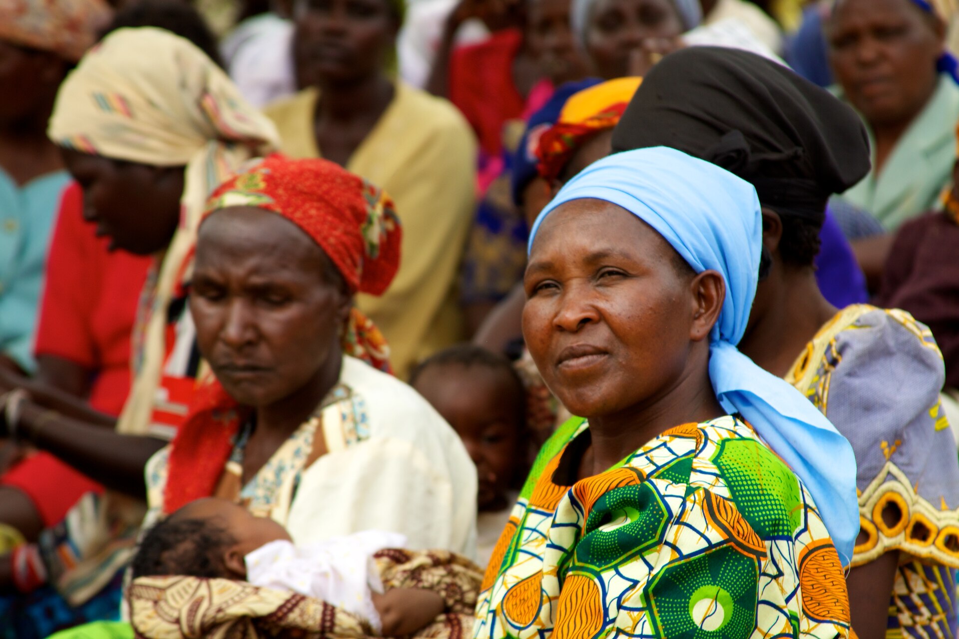 Placeholder photo: a women's community self-help group meeting