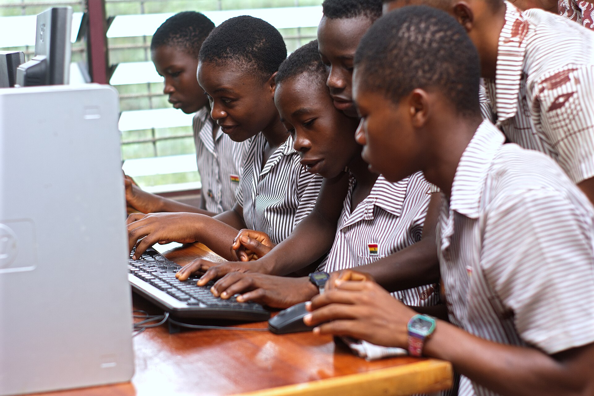 Placeholder photo: students working together at a desktop computer
